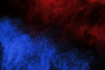 Blue and Red color powder explosion on black background. Colored cloud. Colorful dust explode. Paint Holi.