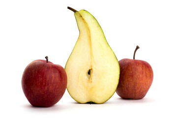Still life with cut pear and two red apples on a white background