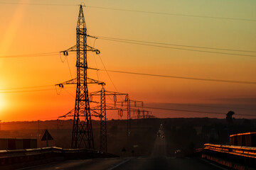 Electric power pylon, electric tower at sunset