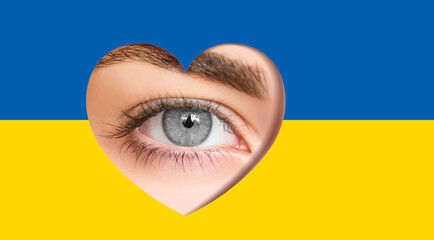 Beautiful girl gray eye in a hole in the shape of a heart with Ukraine flag. Shining skin color foreground