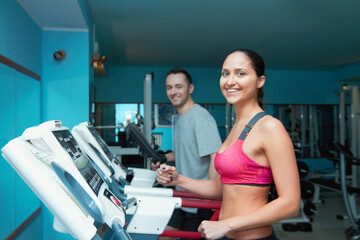 Fototapeta premium Getting expert exercise advice. Shot of an attractive young woman and her trainer in the gym.
