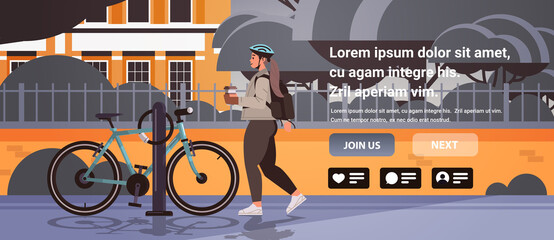 female cyclist taking break during bike ride woman in helmet with takeaway coffee cup standing near bicycle - obrazy, fototapety, plakaty