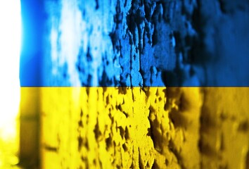 Flag of Ukraine on old wall in background