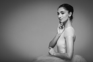 classic black and white photo, young pretty, fragile, beautiful ballerina dancing in a long pale...