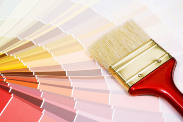 A painter is choosing a paint shade for the interior of the house's walls. with interior