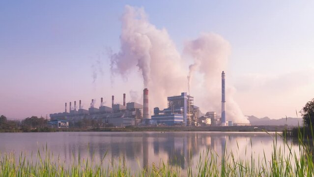 Time lapse video 4K motion, Industrial landscape, coal-fired power plants smoke, industrial pollution causes atmospheric pollution and environmental problems, eco industrial scene.