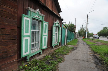 Petropavlovsk, Kazakhstan - 08.08.2013 : Wooden house along the street with decorative shutters at the window.