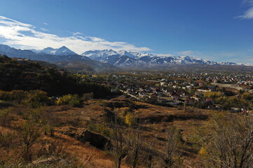 Naklejka premium Almaty, Kazakhstan - 10.19.2012 : Residential buildings and commercial buildings located in the city center at the foot of the mountains.