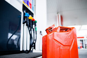 Fossil fuel crisis and shortage. Close up view of gas canister in front of the petrol station. Rising fuel prices.