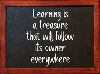 Learning is a treasure. Motivational quote on blackboard.