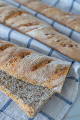 Home made fresh french Baguette loafs on a table