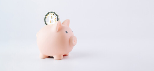 Save money business bitcoin. Pink pig bank with golden bit coin BTC on white background. Save cryptocurrency virtual money concept.