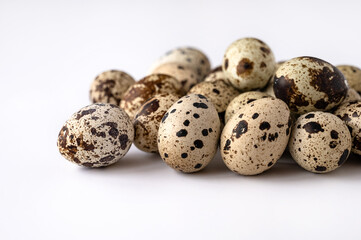 quail eggs on white background for sale to customer. Business of quail breeding, poultry farming. Healthy food, buying eggs for Easter holiday