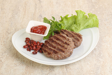 Grilled beef burger cutlet with sauce