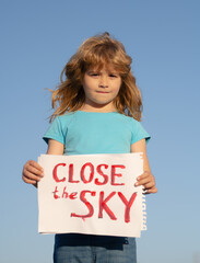 Close the sky over Ukraine banner. No fly zone over Ukraine. Close sky help now and Ukrainian flag....