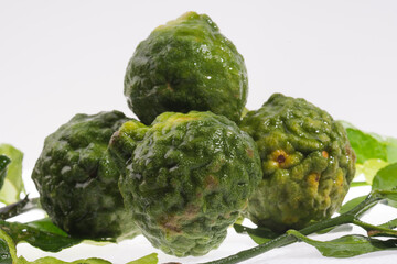 Obraz premium Fresh bergamot herb closes up on the white background. 