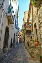 A narrow street among the old stone houses of Altavilla Silentina, town in Salerno province, Italy.	