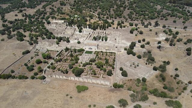 Aerial drone view of the Caliphate City of Medina Azahara in Cordoba. Archaeological site. Unesco World Heritage, Spain. Ancient civilization. Historic place. Touristic destination for holidays. 
