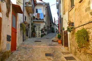 A narrow street among the old stone houses of Altavilla Silentina, town in Salerno province, Italy.	