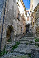 Fototapeta na wymiar A narrow street among the old stone houses of Altavilla Silentina, town in Salerno province, Italy. 
