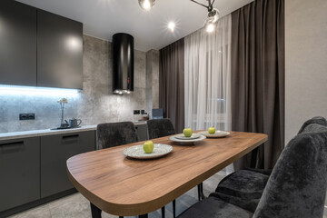 interior of the small living equipped kitchen  in studio apartments in minimalistic style