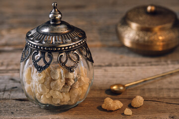 Glass with high quality aromatic frankincense resin from Oman (Boswellia) used for religious rites,...