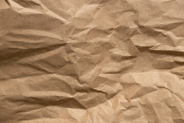 Brown crumpled paper as background close-up,brown background