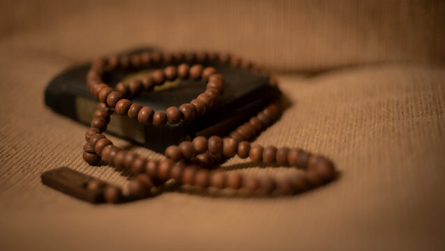Defocused background of Islamic prayer beads or tasbih , religion moeslem stuff