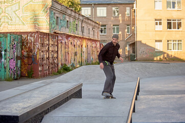 a skateboarder rides a skateboard in a skatepark