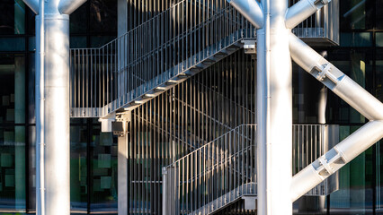 staircase with metal stairs and railings leading upwards, an element of urban architecture