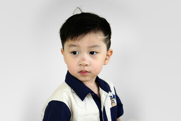 portrait of a little boy with modern hairstyle. Fashionable child in casual shirt.stylish little boy with trendy haircut. 