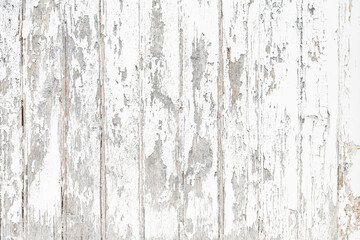 Mur en bois texturé dont la peinture blanche est écaillée