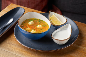 Chicken soup with meatballs. Selective focus, copy space.
