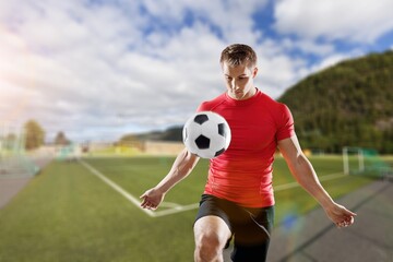 Happy young man football fan in t-shirt cheer up support favorite team hold soccer ball