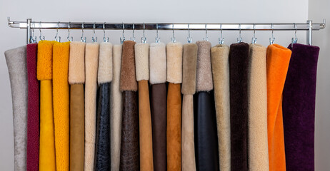 Leather fabrics obtained from natural animals, not yet processed. colored leather pieces hanging