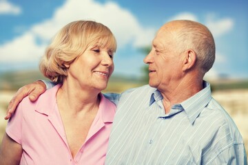 Happy active senior couple outdoors posing