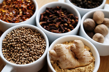 Trikatu spices and herbs: ginger, nutmeg, coriander, black, cayenne pepper, cloves. Ayurvedic...