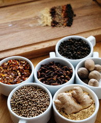 Trikatu spices and herbs: ginger, nutmeg, coriander, black, cayenne pepper, cloves. Ayurvedic...