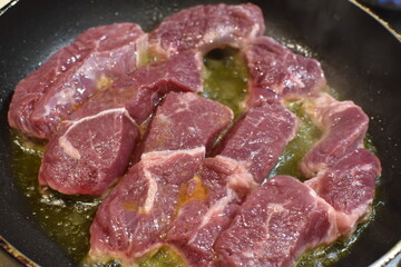 Fried beef in a pan