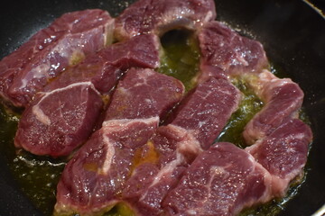 Fried beef in a pan