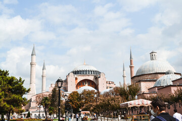 Naklejka premium Sultan Ahmet, Ayasofya Meydanı , 34122 Fatihİstanbul - 10.15.2020 : Tourists wandering around Istanbul Sultanahmet Mosque and Hagia Sophia media and daily life