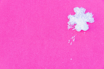 Pink background with snow flower (copy space).