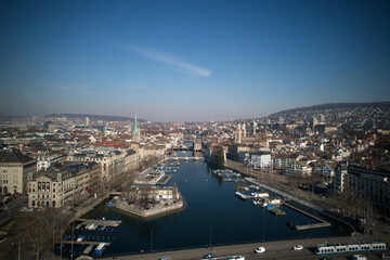 Fototapeta premium Aerial view of City of Zürich with river Limmat, the medieval old town and lake Zürich on a sunny spring afternoon. Photo taken March 4th, 2022, Zurich, Switzerland.
