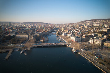 Fototapeta premium Aerial view of City of Zürich with river Limmat, the medieval old town and lake Zürich on a sunny spring afternoon. Photo taken March 4th, 2022, Zurich, Switzerland.
