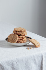 Stack of homemade oat cookies with shadows