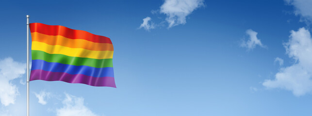 Rainbow gay pride flag isolated on a blue sky. Horizontal banner