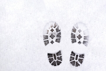 trail of shoes in the snow, tread in the snow.