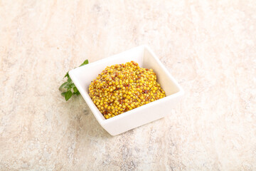 Grain mustard sauce in the bowl