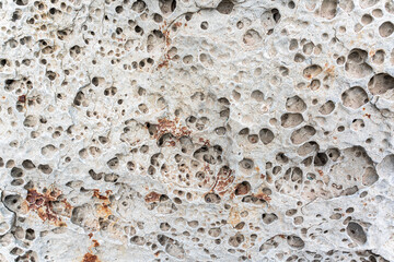texture of porous stones on the beach, nature, natural phenomena, brown gray stones