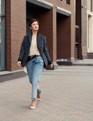 Beautiful woman on the street. Street style fashion.